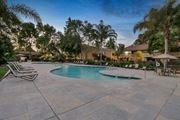 Santa Clara apartment for rent - a swimming pool with chairs and umbrellas at Summerwood Apartments, Santa Clara, CA