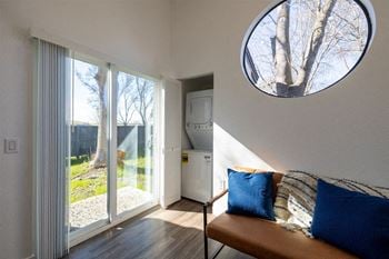 A living room with a large window and a couch