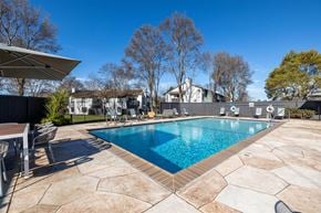 Livermore apartment for rent - a swimming pool with a house in the background at Diablo Vista, California