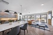 San Diego apartment for rent - A modern dining area with a long table and chairs at Latitude Apartments at Mission Valley Apartments, San Diego