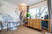 Union City apartment for rent - A modern dining area with a round table and chairs.at Summerhill Place Apartments, Union City, CA