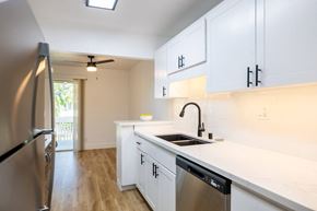 Santa Clara apartment for rent - A kitchen with white cabinets and a stainless steel dishwasher at Summerwood Apartment , Santa Clara, California