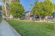 Tarzana apartment for rent - apartment community with grass and trees at BLVD Apartments LLC, Tarzana, CA 91356