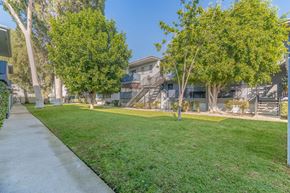 Tarzana apartment for rent - apartment community with grass and trees at BLVD Apartments LLC, Tarzana, CA 91356