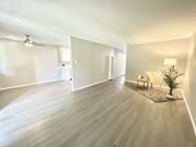 Tarzana apartment for rent - a living room with a hard wood floor and white walls at BLVD Apartments LLC, Tarzana
