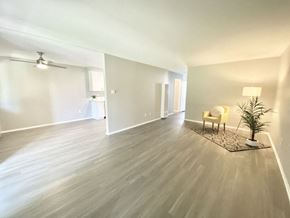 Tarzana apartment for rent - a living room with a hard wood floor and white walls at BLVD Apartments LLC, Tarzana