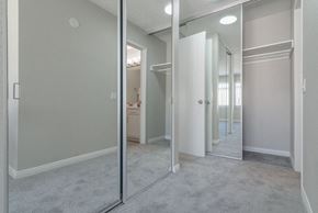 San Diego apartment for rent - an empty bedroom with mirrored closet doors and a bathroom at Citra Apartments LLC, California, 92107