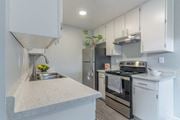 Marina apartment for rent - Kitchen with stainless steel appliances and white cabinets at The Gates at the Marina Apartments, California, 93933