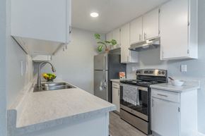 Marina apartment for rent - Kitchen with stainless steel appliances and white cabinets at The Gates at the Marina Apartments, California, 93933