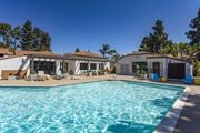 San Diego apartment for rent - a swimming pool with a house in the background at La Jolla Blue, San Diego, CA 92122