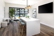 San Diego apartment for rent - a kitchen with a long white counter top and a bar with stools at La Jolla Blue, San Diego, 92122