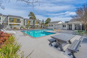 Napa apartment for rent - a swimming pool with a picnic table and chairs around it at Napa Green Apartments LLC, Napa, CA 