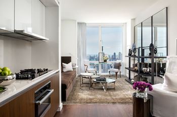 A modern kitchen with a view of the city.