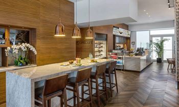 A kitchen with a marble counter top