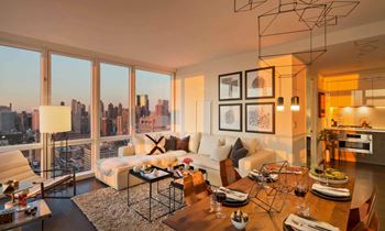A living room filled with furniture and a large window