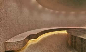 A close up of a stone wall with a ray of light on it
