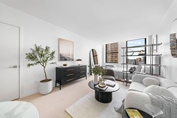 Living room with plenty of natural light at one west, new york, new york