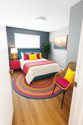 San Jose apartment for rent - A bedroom with a bed, a chair, and a rug.