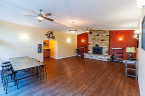 Fremont apartment for rent - A living room with a fireplace and a dining table.