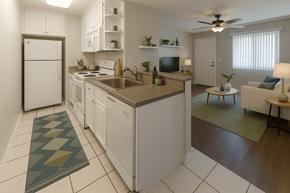 Hayward apartment for rent - A kitchen with white cabinets and a checkered rug.