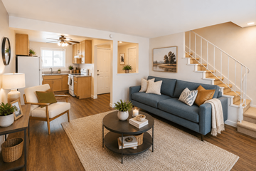 San Leandro apartment for rent - A living room with a blue couch and a coffee table.