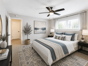 Concord apartment for rent - A bedroom with a large bed and a ceiling fan.