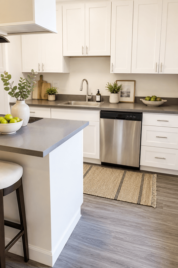 Concord apartment for rent - A kitchen with a white counter and a stainless steel dishwasher.