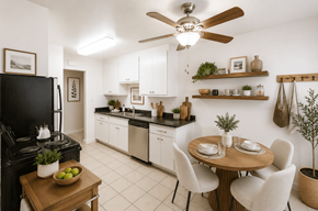 Hayward apartment for rent - A kitchen with a black stove top oven and white cabinets.
