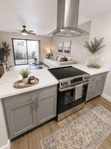 San Lorenzo apartment for rent - A modern kitchen with a black stove top oven and a marble counter top.