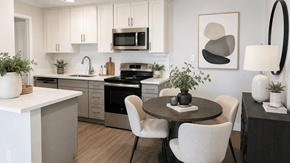 San Leandro apartment for rent - A modern kitchen with a dining table set for two.