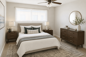 San Leandro apartment for rent - A bedroom with a large bed, two nightstands, and a ceiling fan.