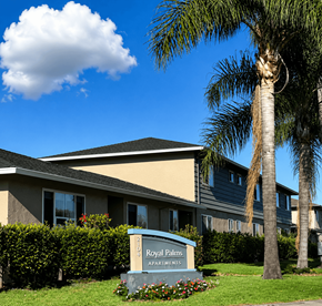 Santa Clara apartment for rent - A building with a sign that says Royal Palms Apartments.