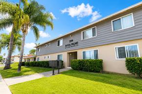Santa Clara apartment for rent - A building with the number 104 and the words "Royal Palms Apartments" on it.