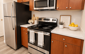Concord apartment for rent - A black stove top oven with a white towel on it.