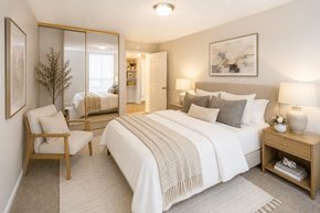Concord apartment for rent - A bedroom with a large bed, a chair, and a nightstand.