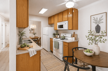 San Leandro apartment for rent - A kitchen with wooden cabinets and a white fridge.