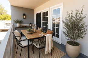 Concord apartment for rent - A patio with a table, chairs, and a potted plant.