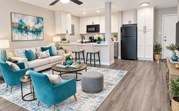 Fremont apartment for rent - A modern living room with a blue chair and a painting on the wall.