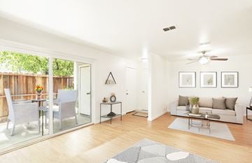 Fairfield apartment for rent - A modern living room with a glass table and chairs.