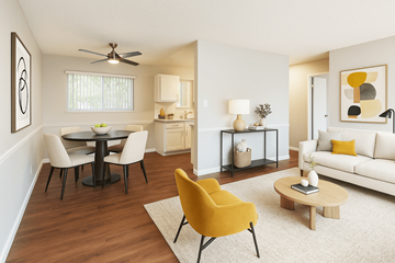 Concord apartment for rent - A living room with a yellow chair and a white couch.