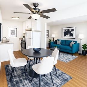 San Jose apartment for rent - A modern dining room with a black table and white chairs.
