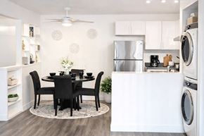 San Leandro apartment for rent - A modern kitchen with a dining table set for four.