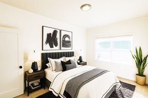 Alameda apartment for rent - A bedroom with a large bed and a painting above it.