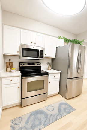 Pleasant Hill apartment for rent - A kitchen with a stove, oven, microwave, and refrigerator.