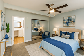 Fremont apartment for rent - A bedroom with a large bed and a ceiling fan.