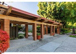 Fremont apartment for rent - A building with a red roof and pillars with a sign that says 3400.