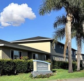 Santa Clara apartment for rent - a palm tree and a sign in front of a building