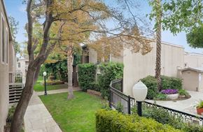 Concord apartment for rent - the backyard of a house with a yard and trees and a sidewalk