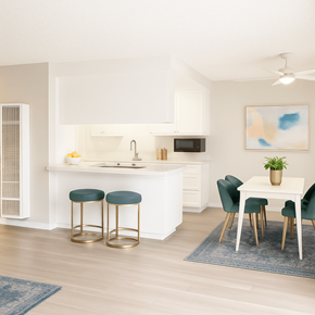 Concord apartment for rent - A kitchen with white cabinets and a white island with a sink and a microwave on top.