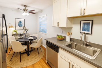 Newark apartment for rent - A kitchen with a table and chairs and a fridge.